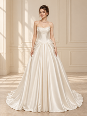 VVSIG-119 bridal gown — front view in warm ivory room